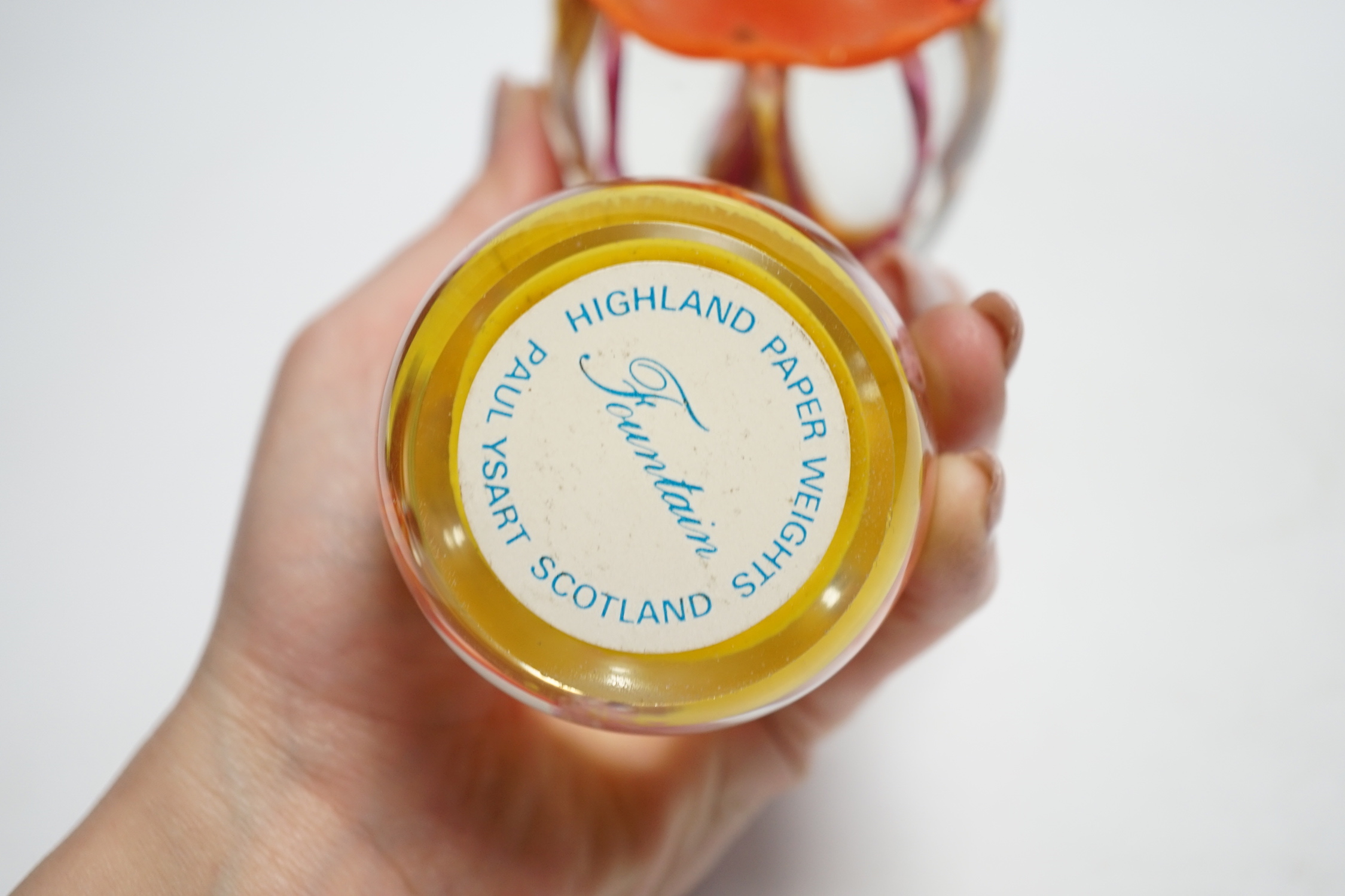 Two Paul Ysart ‘fountain’ glass paperweights, Harland/Highland period, one with Highland paperweights label, 7.5 and 7.7cm